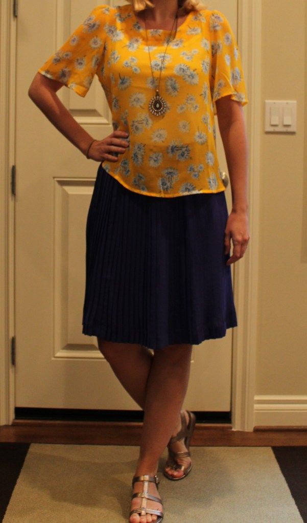 accordion skirt and yellow blouse