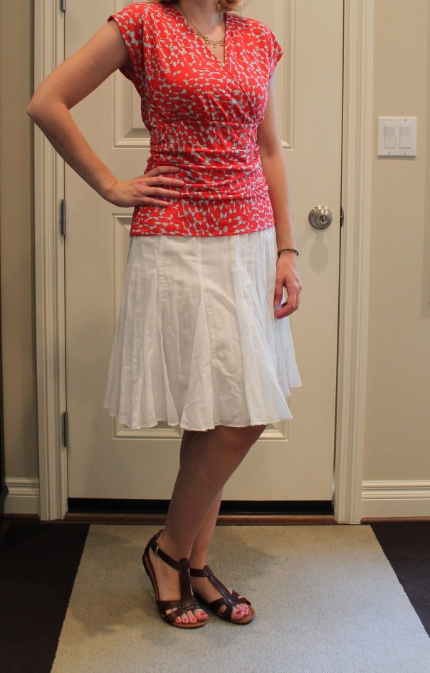 red top and white skirt