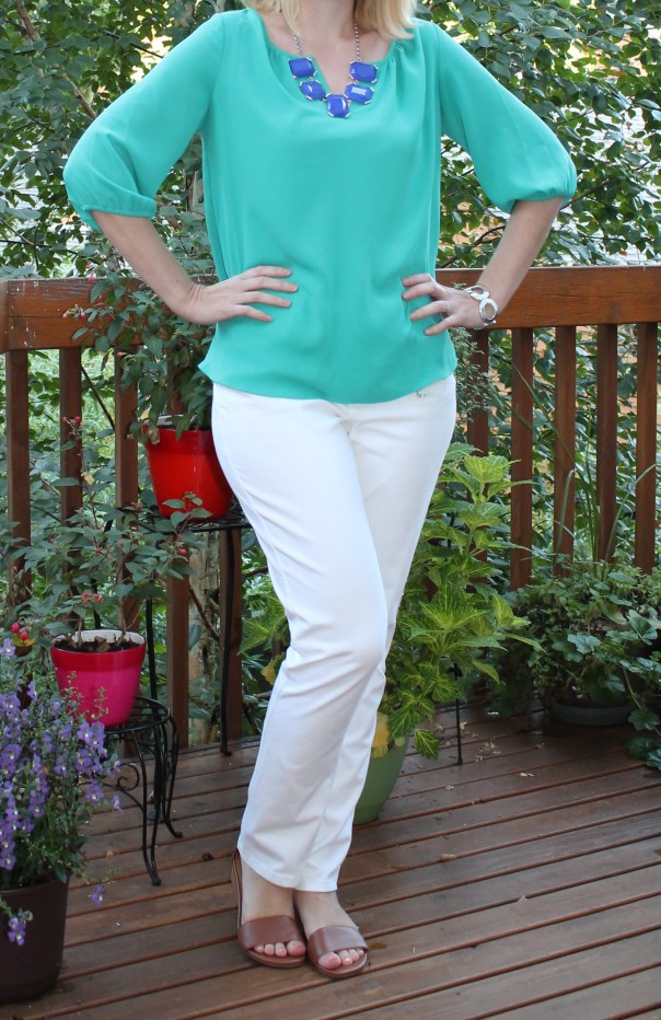 Teal blouse white jeans